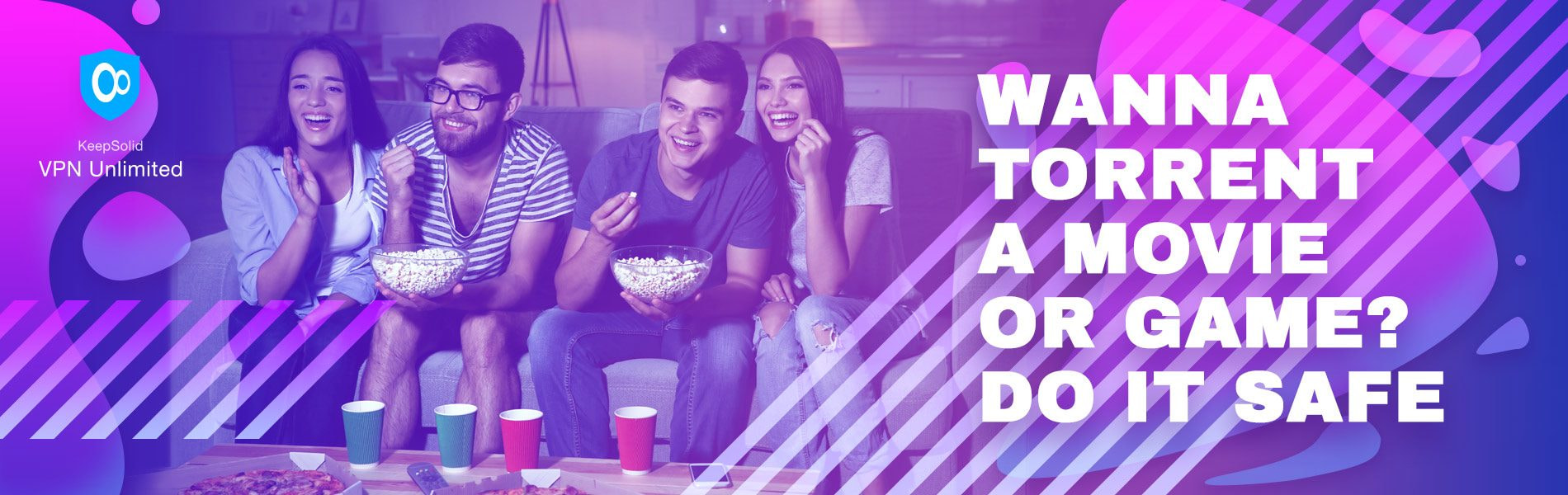 4 people sitting on a coach watching movie they torrented